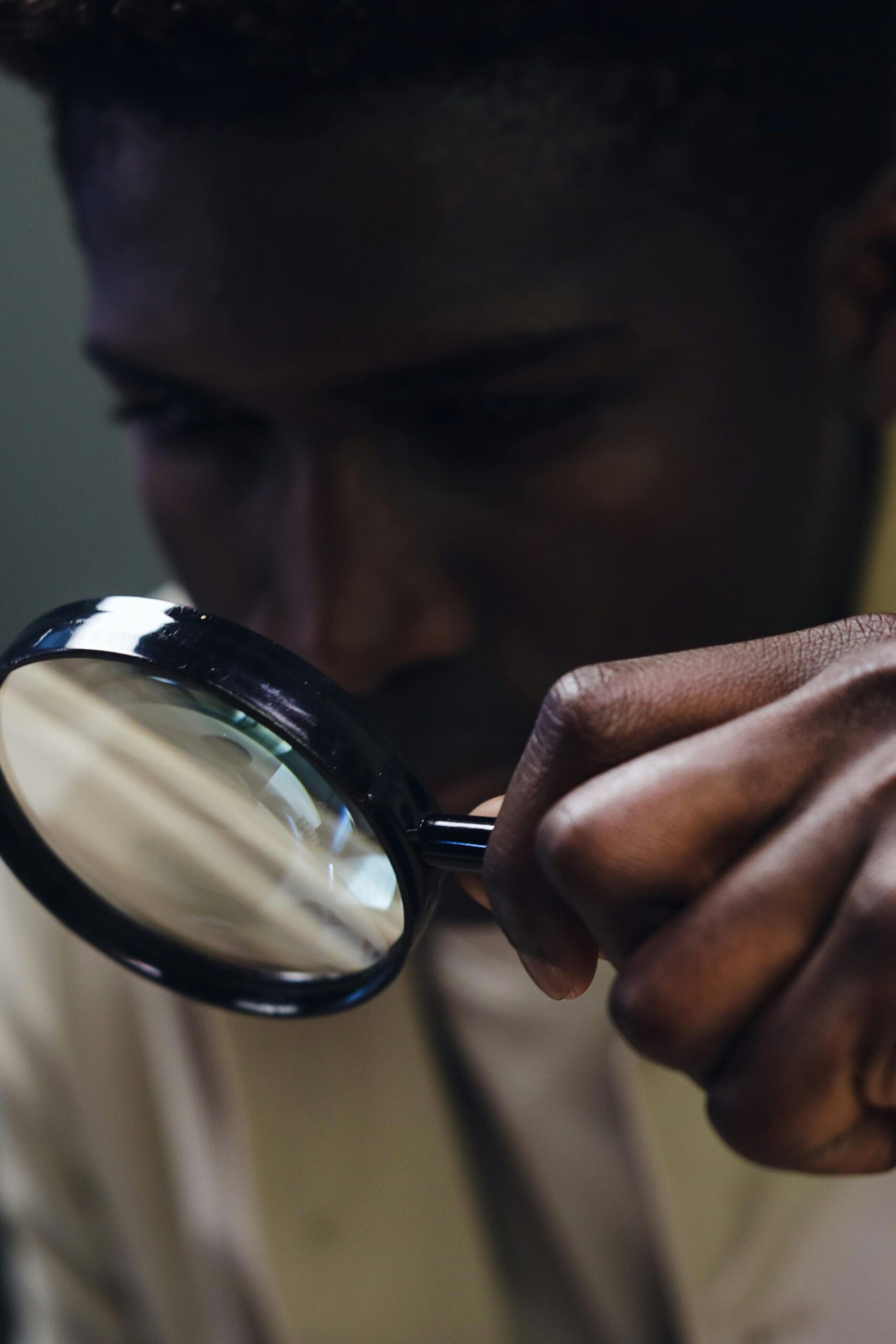 A Man Holding a Magnifying Glass